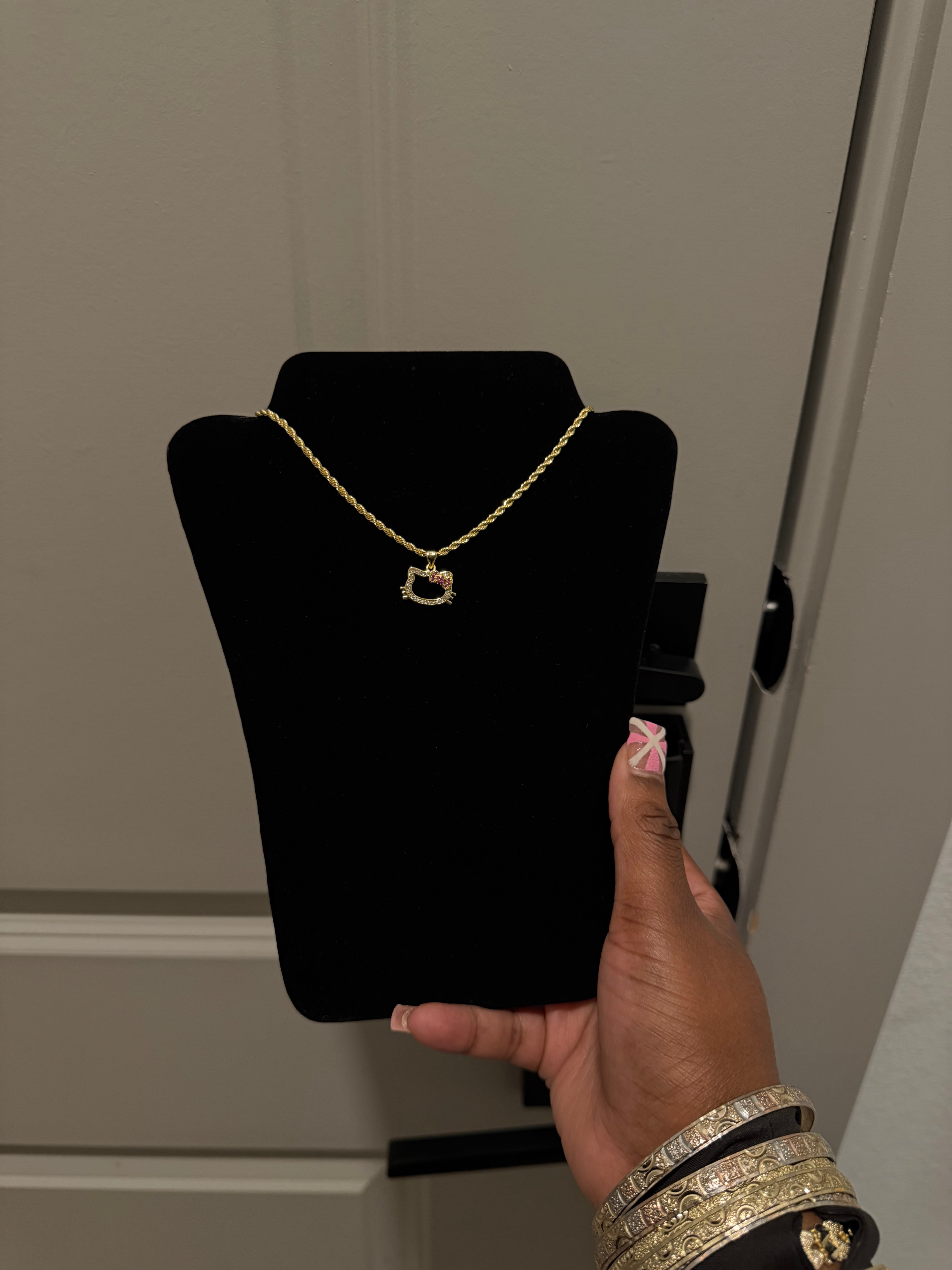 Open face pink bow HK chain